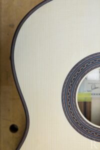 Top purfling detail on spruce top classical guitar