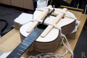 Gluing on Indian rosewood bridge for handmade classical guitar