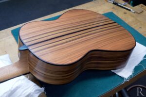 Finely sanded back of Santos rosewood classical guitar