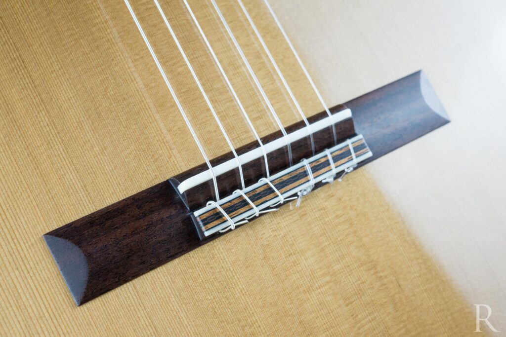 Rosewood bridge on cedar top handmade classical guitar