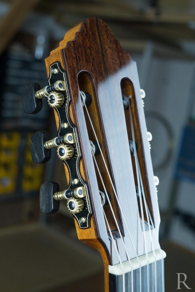Front view of classical guitar headstock with Indian rosewood